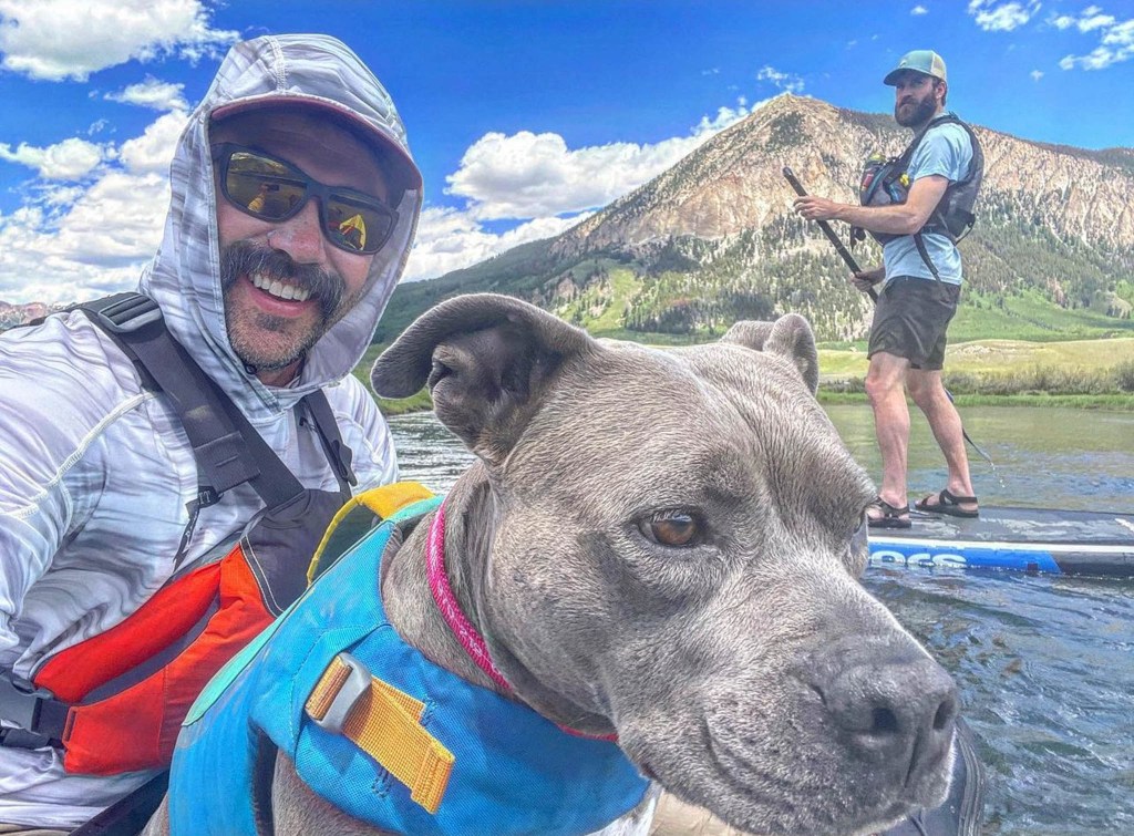 Paddle boarding Slate River near Crested Butte with pitbull dog