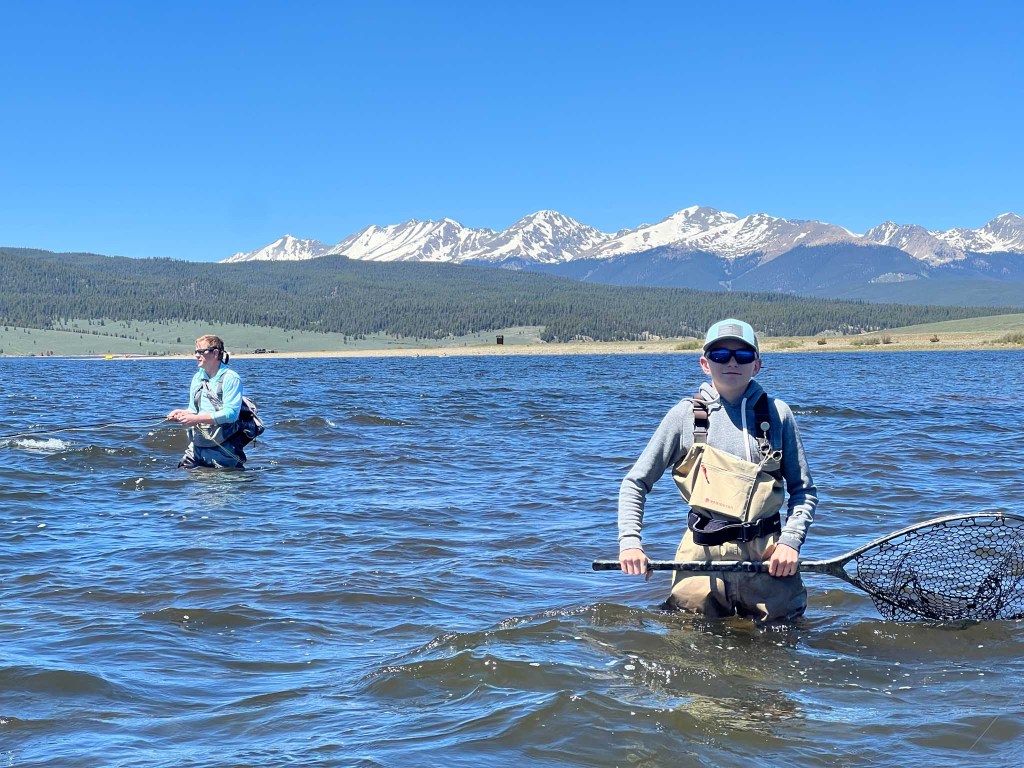 father son duo fly fishing in Taylor Reservoir