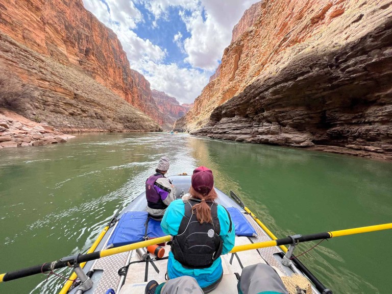 woman rowing a raft in the grand canyon colorado river