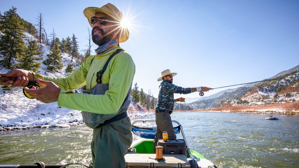 men fly fishing on raft upper colorado river