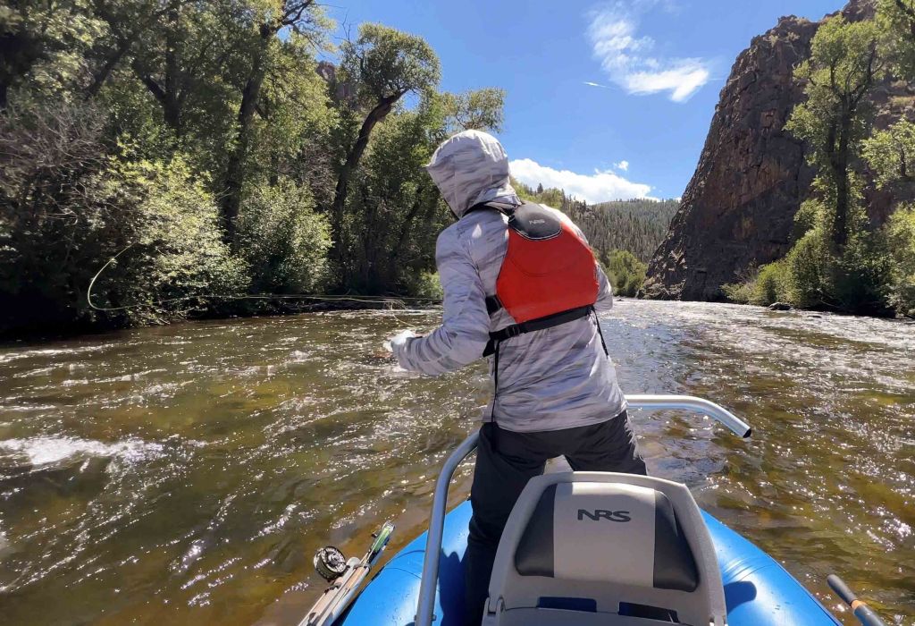 float fly fishing in blue raft Taylor River near almont colorado 