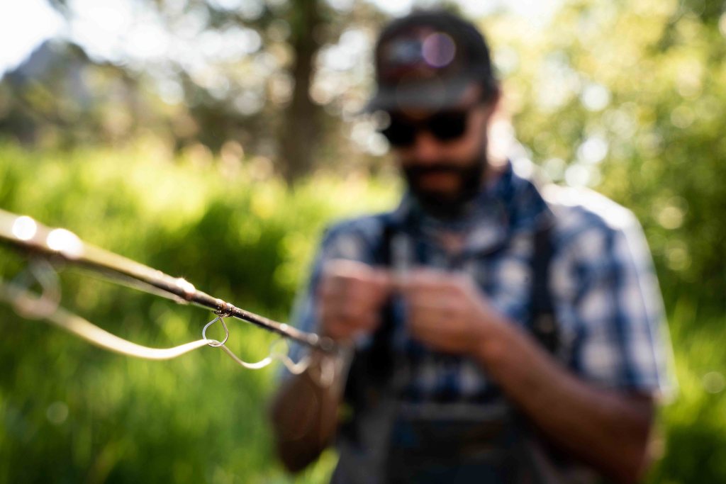 tying a fly to a fly fishing setup