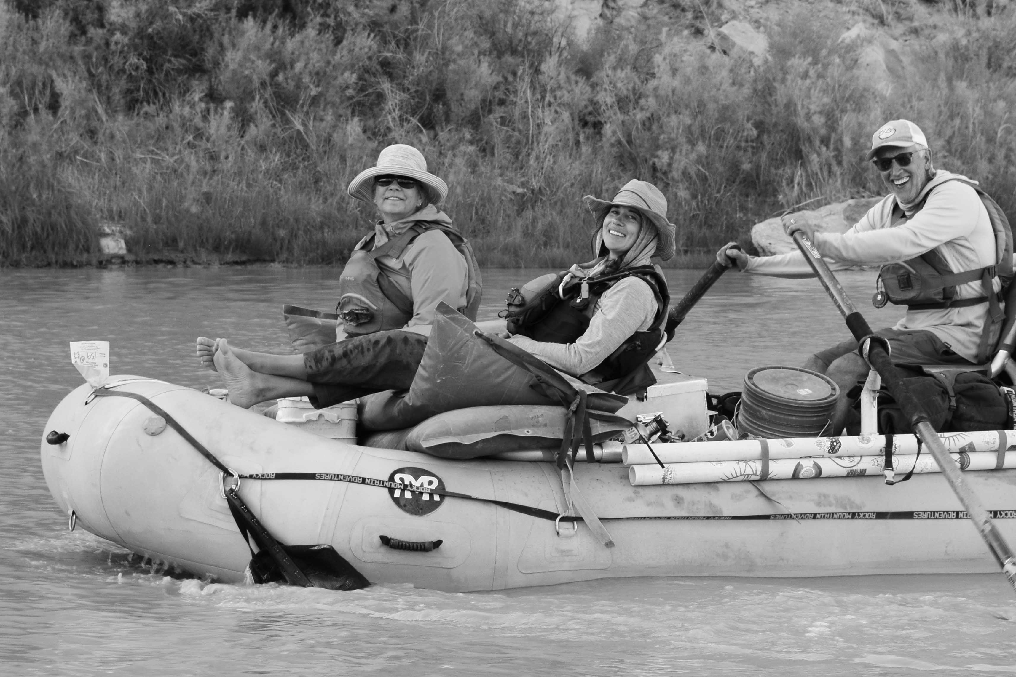 3 people rafting RMR raft in desolation canyon