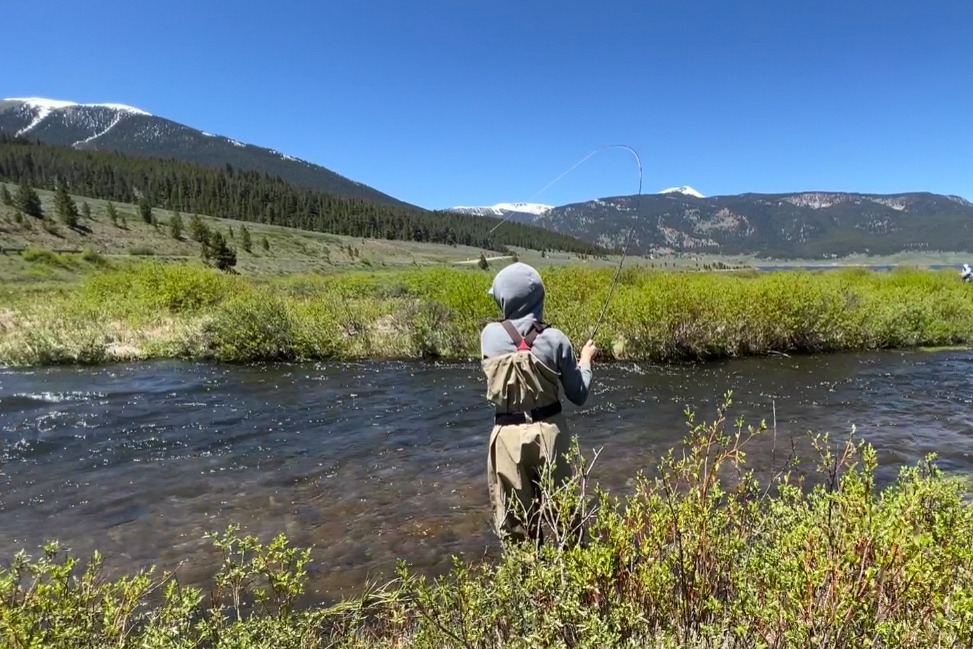Kid fly fishing willow creek in taylor reservoir park