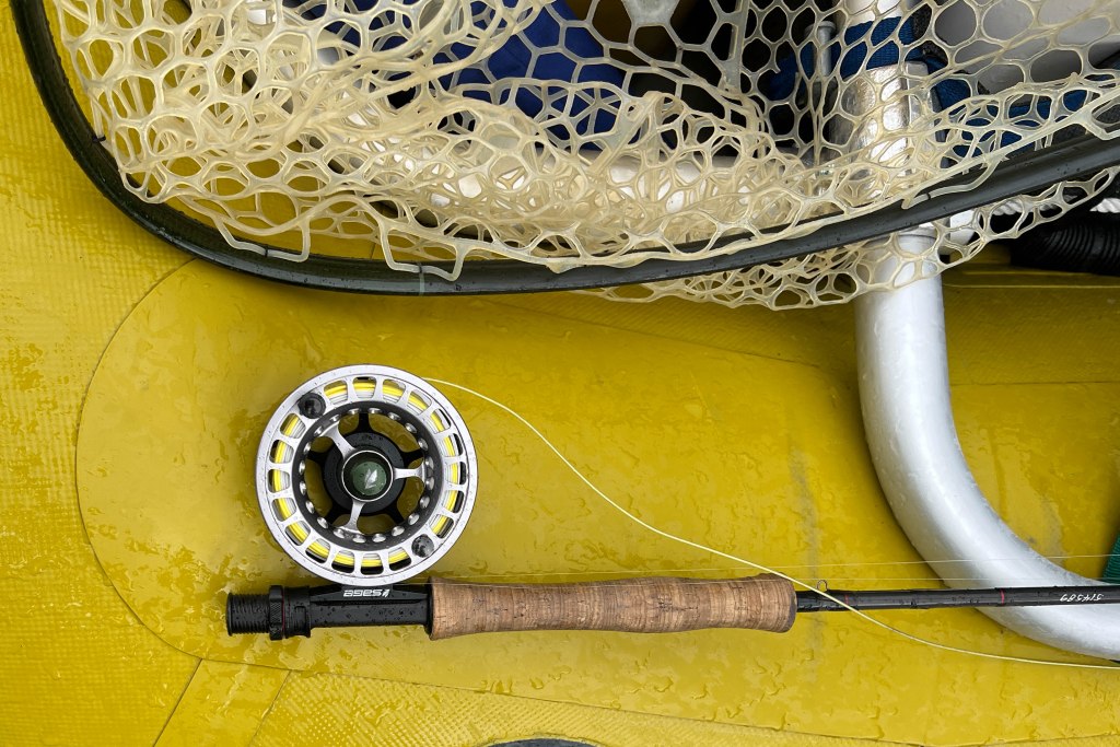 Scott Centric Rod with Sage Spectrum LT Reel on yellow raft