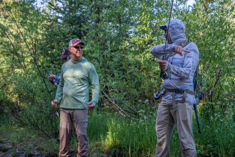 two people fly fishing in sun shirts