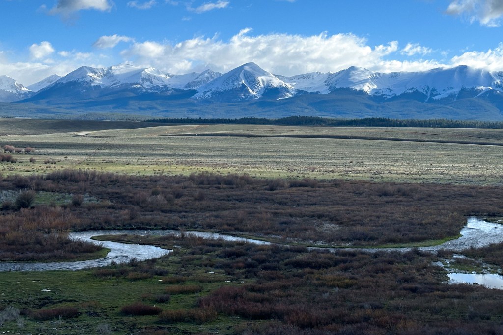 Willow Creek in Taylor Park with snowy mountains May 2024