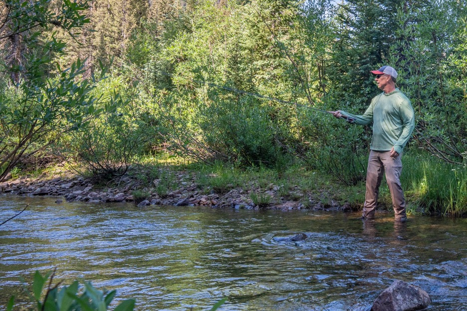 man fly fishing coal creek near crested butte